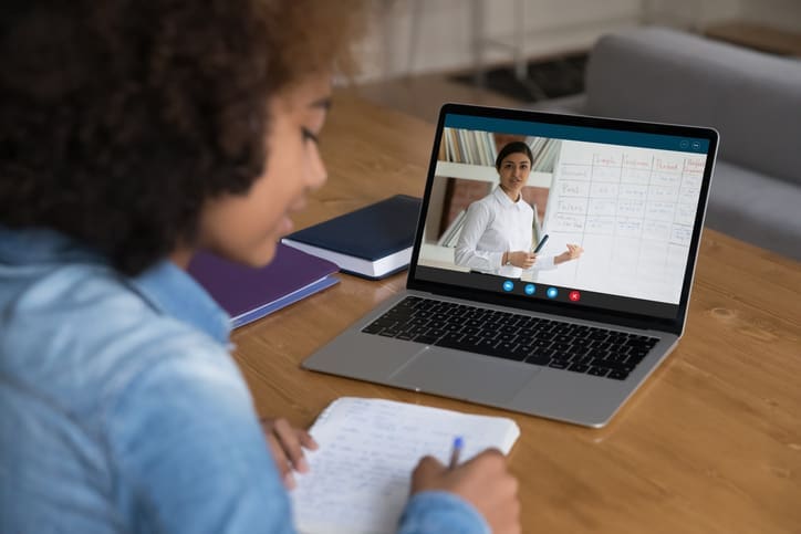 Woman watching an online class on her laptop