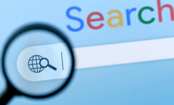A magnifying glass over a search engine search page