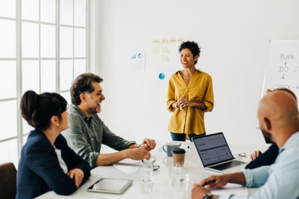 A small business team around a table creating a content plan