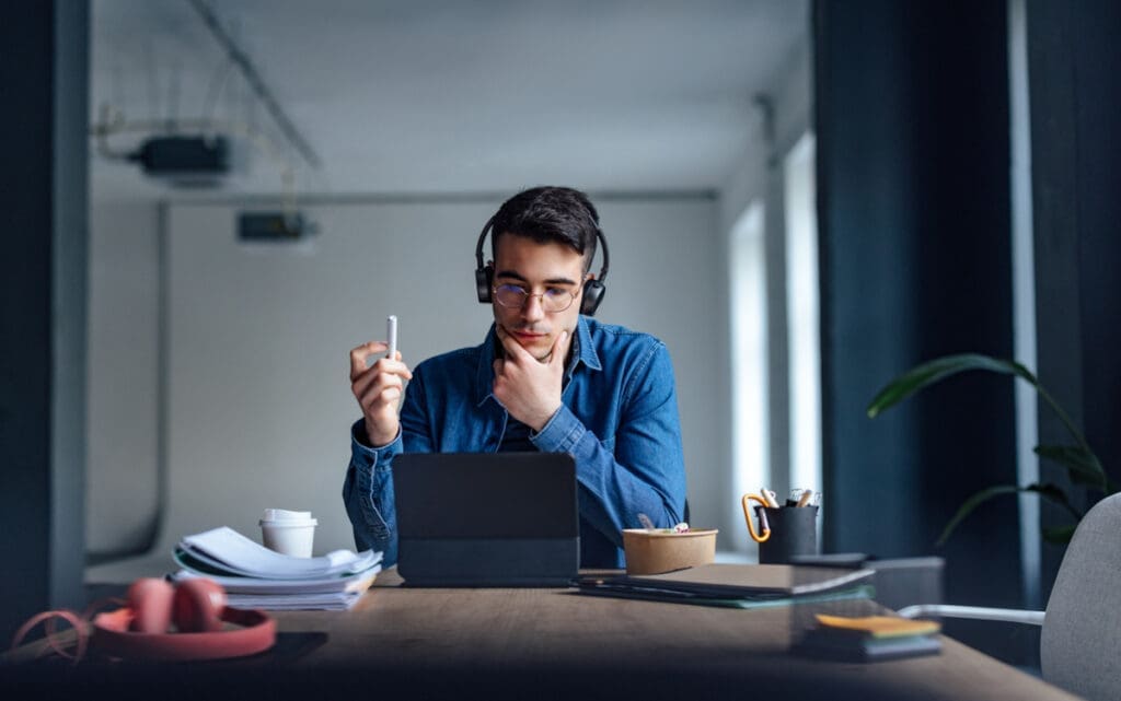 An online student working on a laptop
